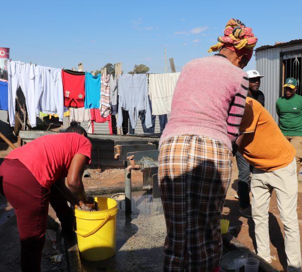 Nomzamo community members using communal taps