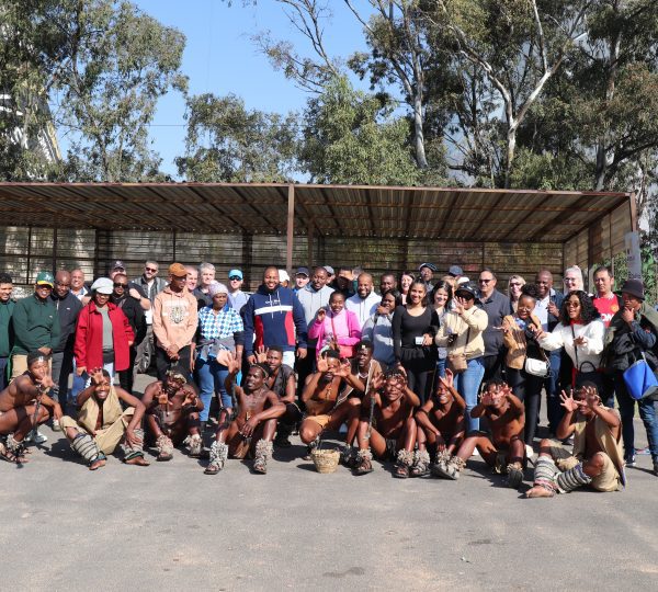 Picture of MaxProf employees with Tswana Traditional Dancers at Chaf-Pozi at the Soweto Towers